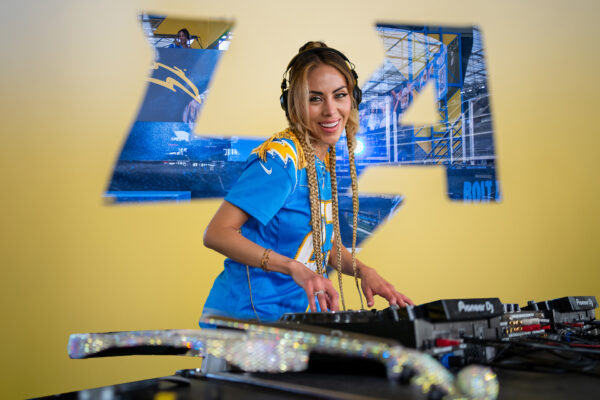 Esther with DJ setup in LA Chargers stadium